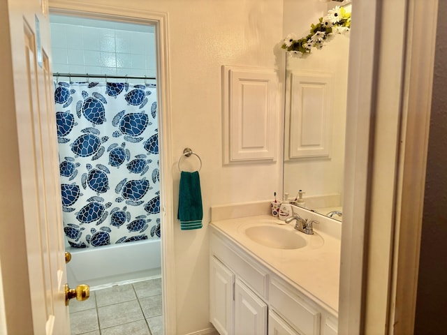 bathroom featuring vanity, tile patterned flooring, and shower / bath combo with shower curtain