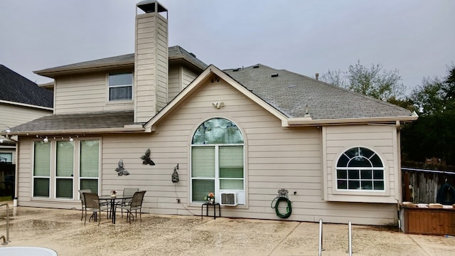 rear view of property featuring a patio area