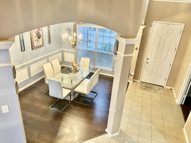 dining room featuring light tile patterned floors and a chandelier