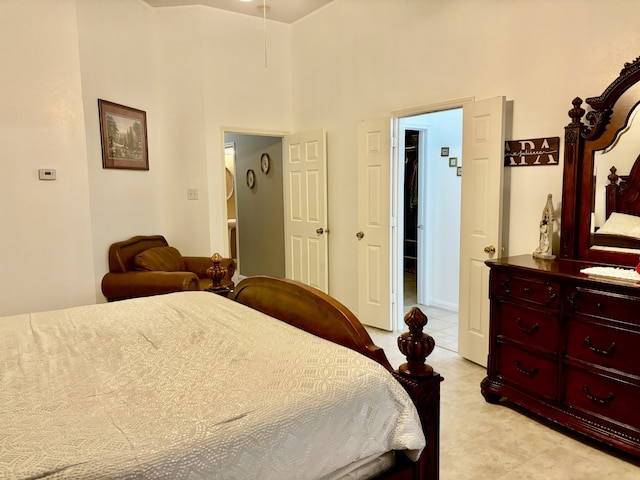 tiled bedroom with a high ceiling