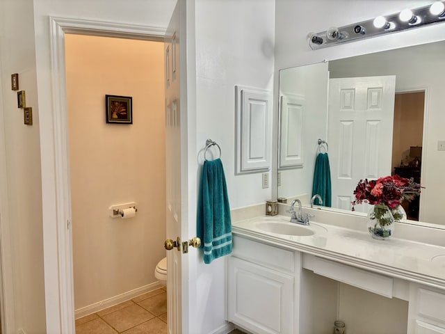 bathroom with tile patterned floors, toilet, and vanity