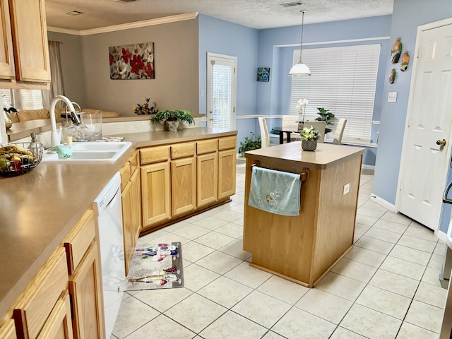 kitchen with sink, hanging light fixtures, a center island, white dishwasher, and a textured ceiling