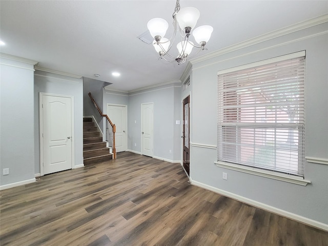 entrance foyer with a notable chandelier, baseboards, stairway, dark wood finished floors, and crown molding