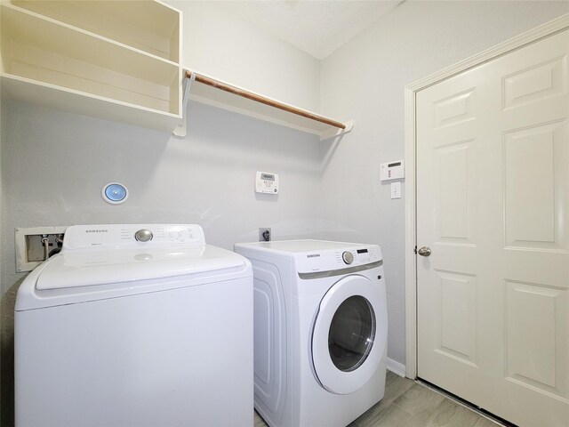 laundry area with washing machine and dryer