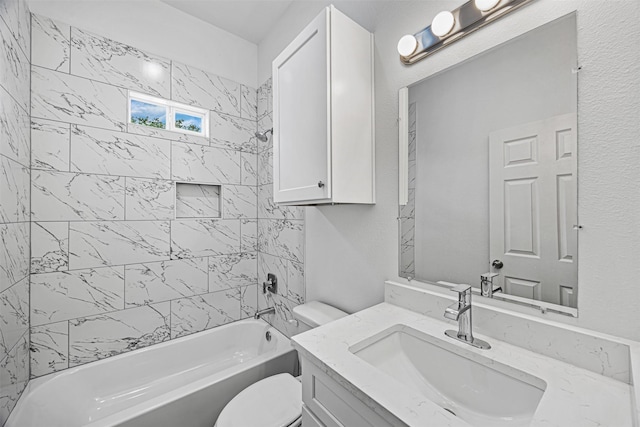 full bathroom with vanity, toilet, and tiled shower / bath