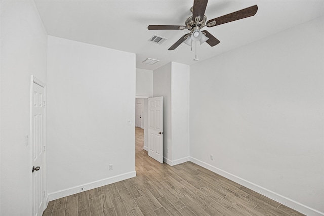 empty room featuring light hardwood / wood-style floors and ceiling fan