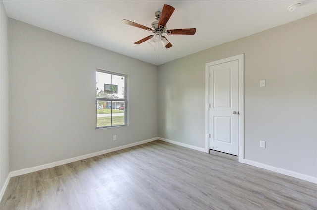 empty room featuring ceiling fan and light hardwood / wood-style floors