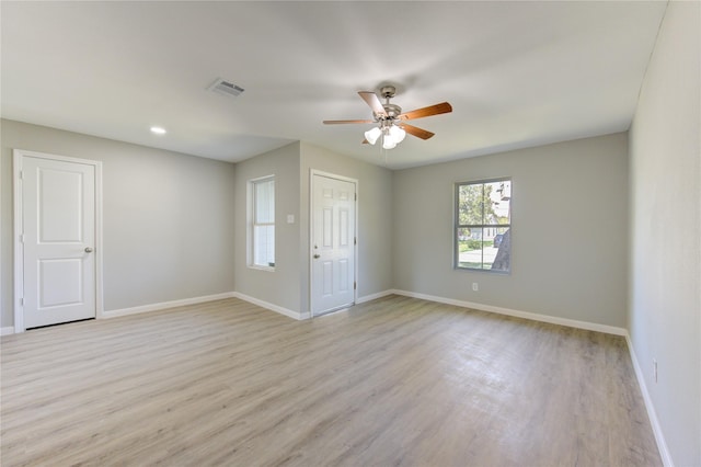 unfurnished room with ceiling fan and light hardwood / wood-style flooring