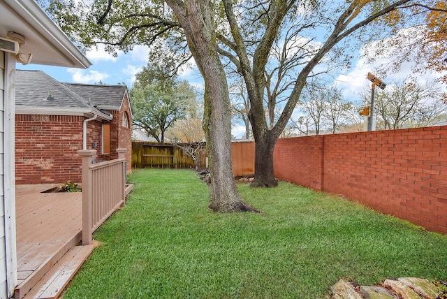 view of yard featuring a wooden deck