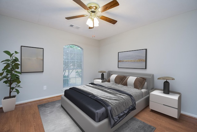 bedroom featuring hardwood / wood-style flooring and ceiling fan