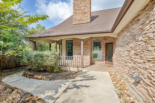 property entrance featuring covered porch