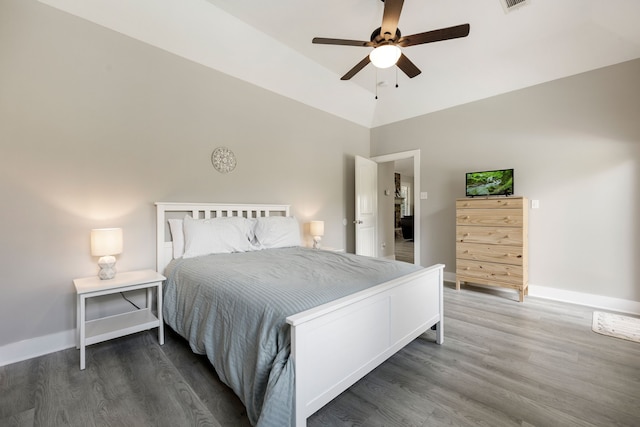 bedroom with dark wood-type flooring, ceiling fan, and lofted ceiling