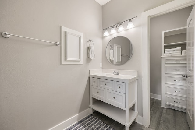 bathroom featuring vanity and wood-type flooring