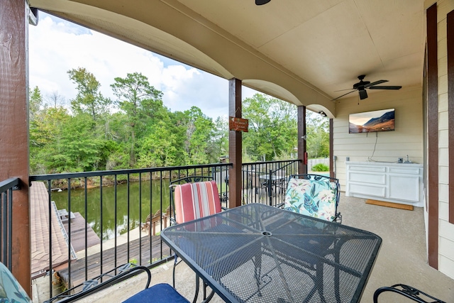 exterior space featuring a balcony and ceiling fan