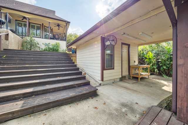 exterior space featuring ceiling fan