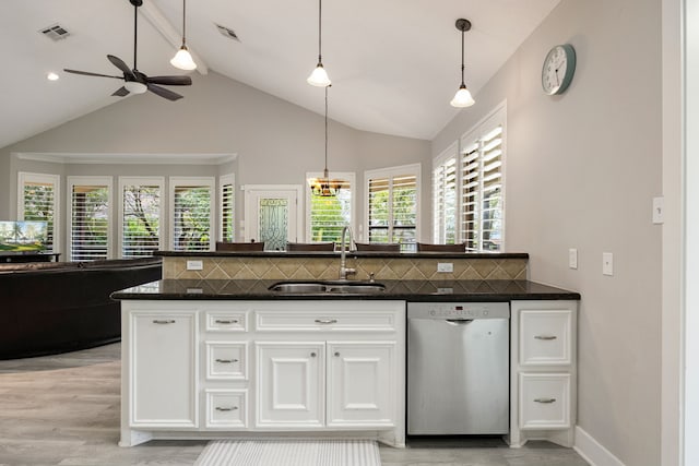 kitchen featuring dishwasher, sink, white cabinets, decorative backsplash, and hanging light fixtures