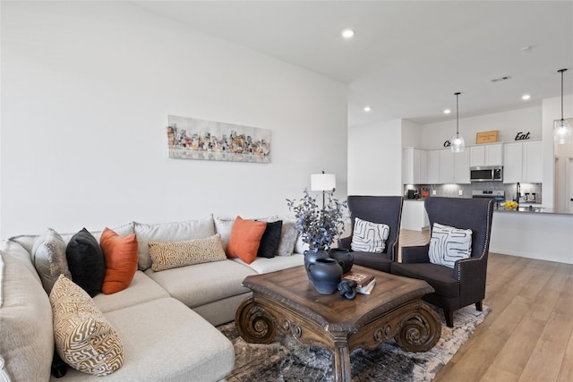 living room with light hardwood / wood-style floors