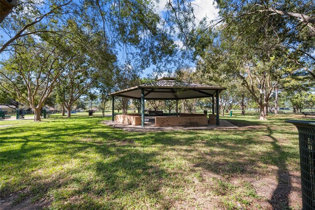 view of home's community with a gazebo and a yard