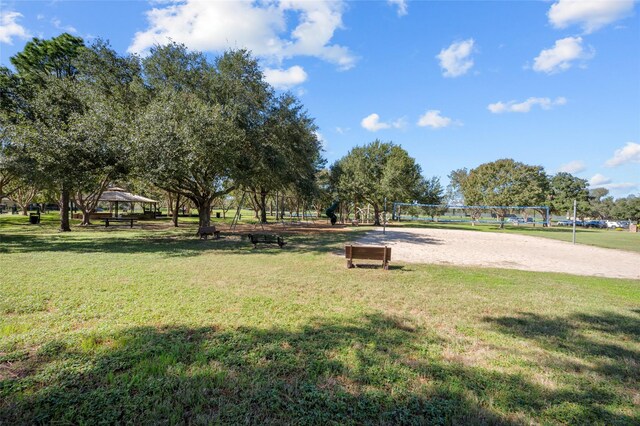 view of community featuring a gazebo, a yard, and volleyball court