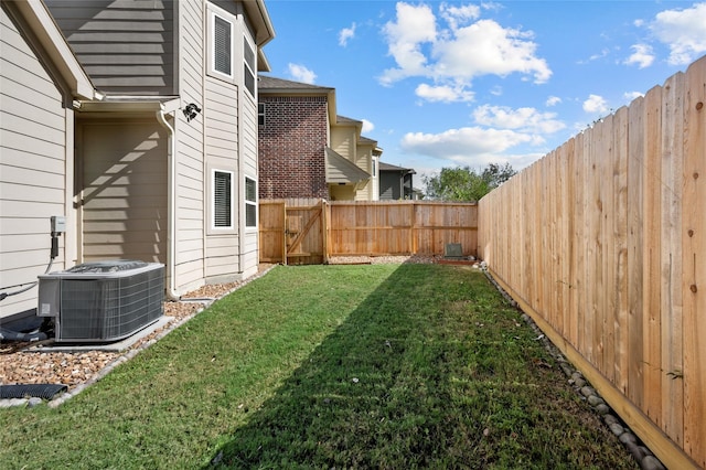 view of yard featuring central air condition unit