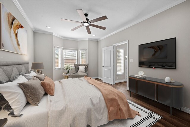 bedroom with dark wood-type flooring, ornamental molding, and ceiling fan