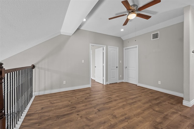 bonus room with dark wood-type flooring, ceiling fan, and vaulted ceiling