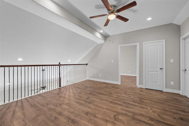 additional living space with hardwood / wood-style flooring, ceiling fan, and vaulted ceiling