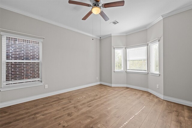 unfurnished room with ceiling fan, ornamental molding, and light hardwood / wood-style flooring