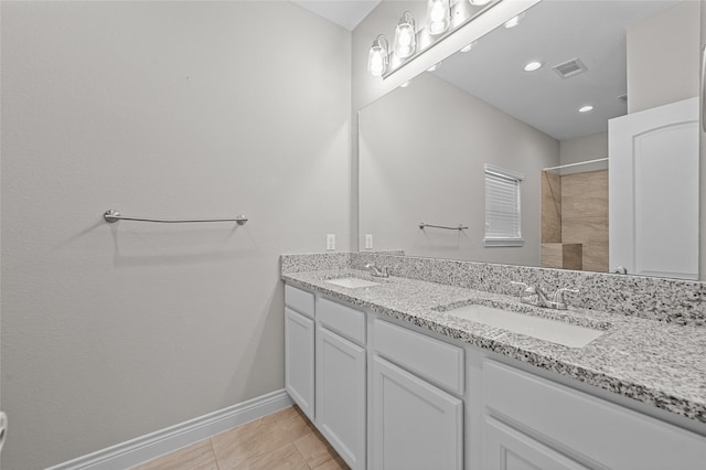 bathroom with tile patterned flooring and vanity