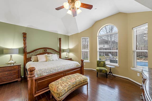 bedroom with ceiling fan, lofted ceiling, and dark hardwood / wood-style floors