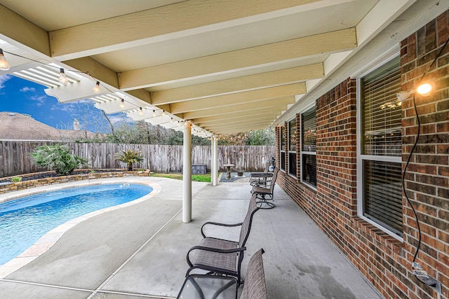 view of pool featuring a patio