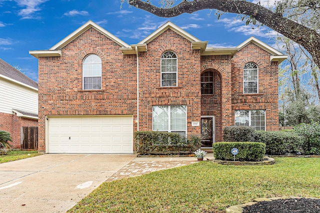 view of front property with a garage and a front yard