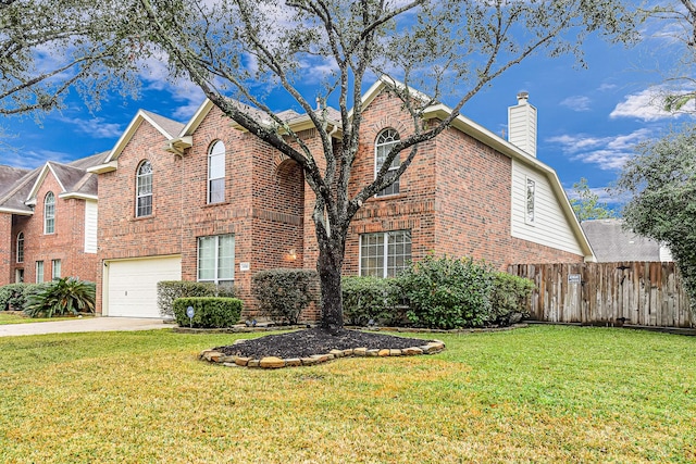 front of property featuring a garage and a front yard