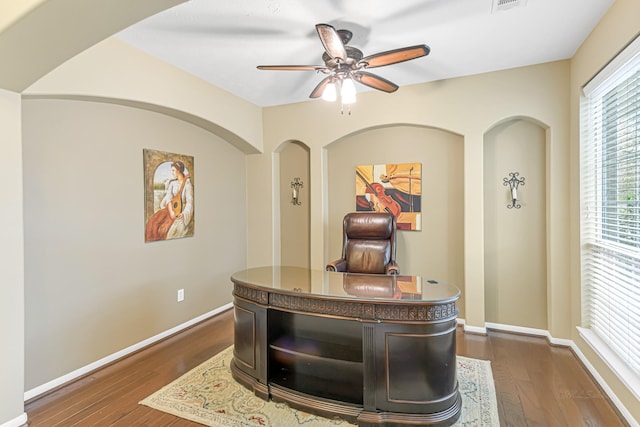 office space featuring dark wood-type flooring and ceiling fan