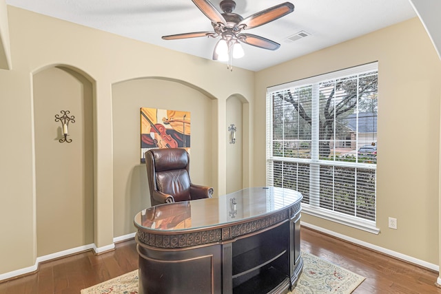 office space with ceiling fan and dark hardwood / wood-style flooring