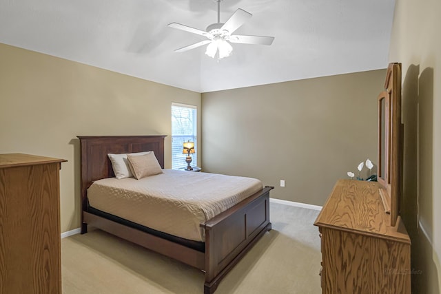 bedroom featuring ceiling fan, light colored carpet, and vaulted ceiling