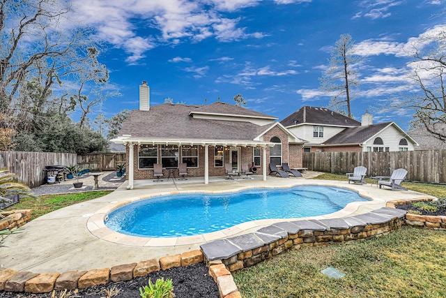 view of swimming pool featuring a patio area