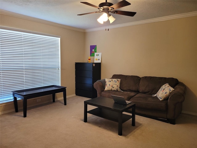 carpeted living room with crown molding and ceiling fan