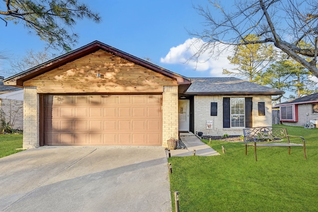 view of front of home featuring a garage and a front yard