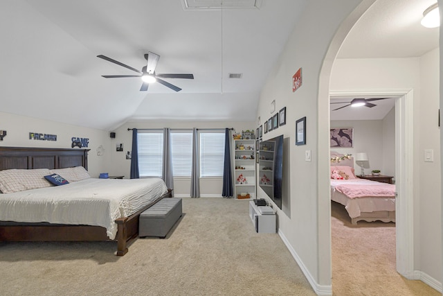 bedroom featuring lofted ceiling, light carpet, and ceiling fan