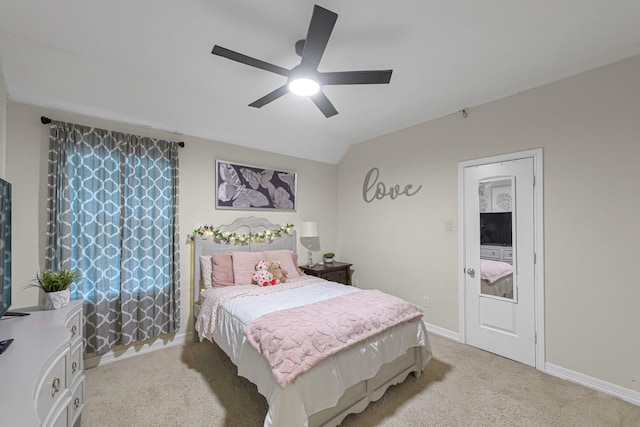 bedroom featuring lofted ceiling, ceiling fan, and carpet