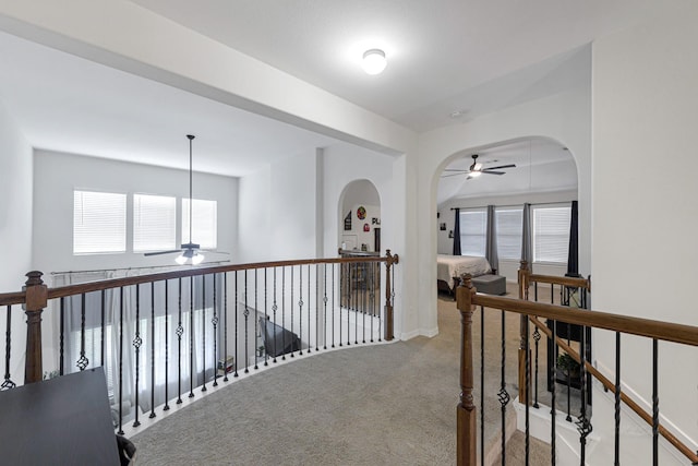 corridor with light colored carpet