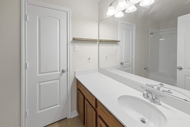 bathroom featuring vanity, tile patterned floors, and bathtub / shower combination