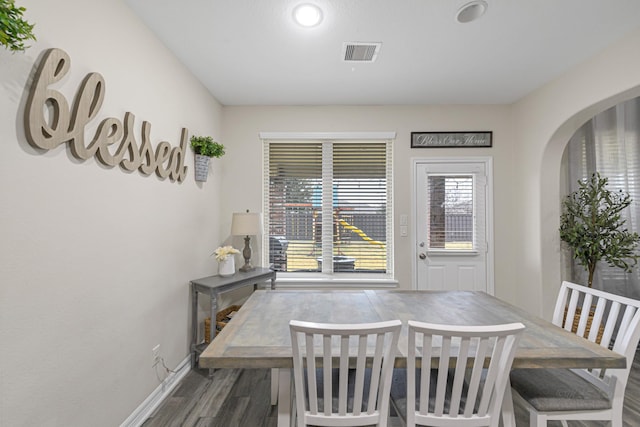 dining room with dark wood-type flooring