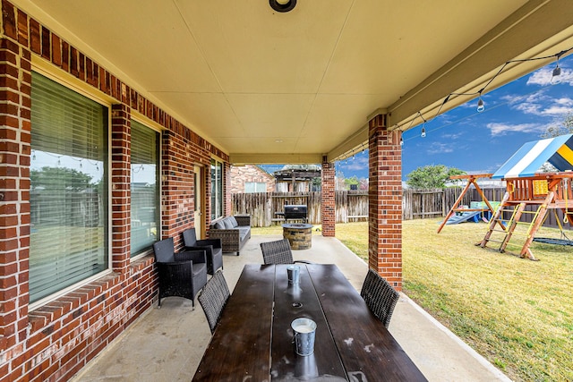 view of patio with a playground, area for grilling, and an outdoor hangout area