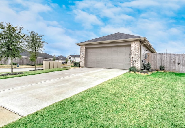 view of home's exterior with a garage and a lawn