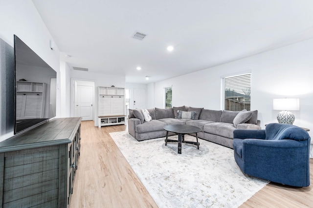 living room with light hardwood / wood-style flooring