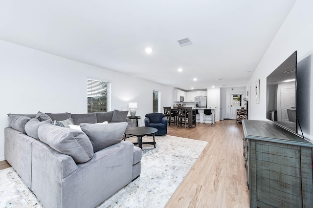 living room with light hardwood / wood-style floors