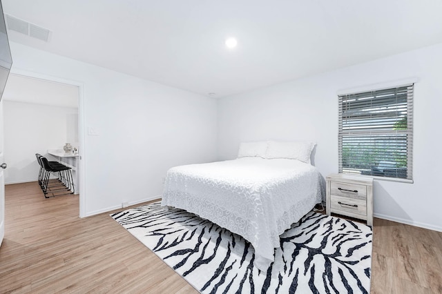 bedroom featuring light hardwood / wood-style floors