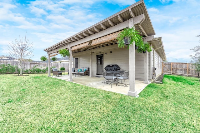 back of property with a patio and a lawn